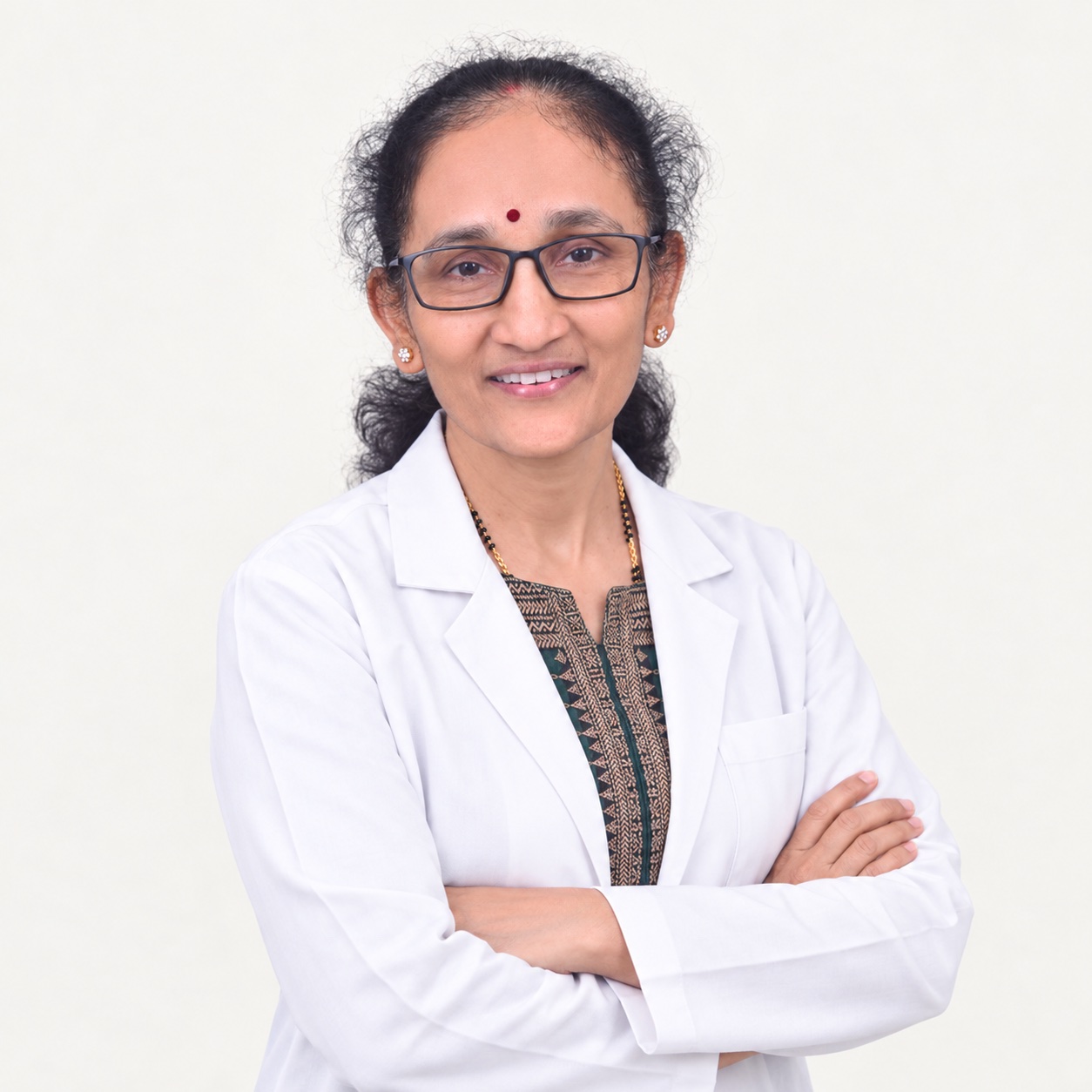 AI-enhanced portrait of Dr. Sudha in a white doctor’s coat with arms crossed